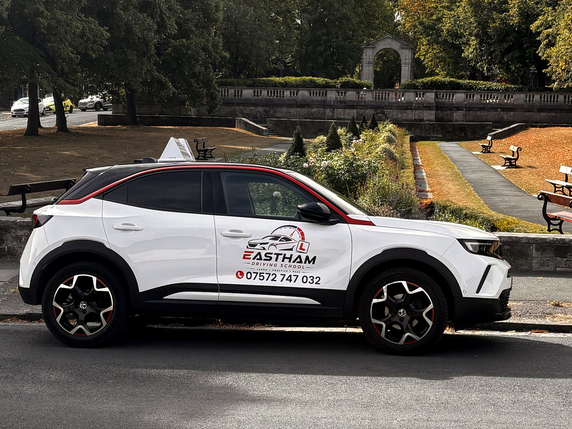 Eastham Driving School dual-control car with door branding, parked in Eastham, Wirral